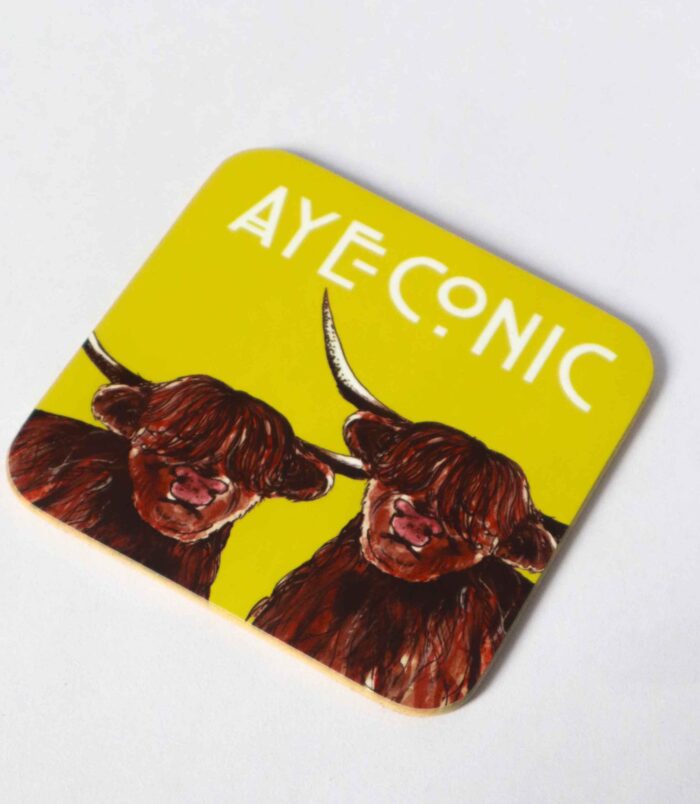 Handprinted Scottish coaster featuring a colourful highland cow design with the words AYECONIC above, perfect for adding a wee bit of Scottish flair to your table. Illustrated and designed by Aff Yer Rocket.