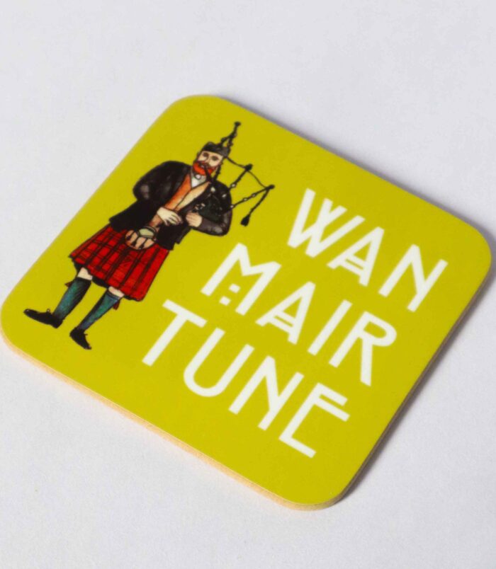 A vibrant green coaster with a watercolour illustration of a man bagpiping with the words 'Wan Mair Tune' next to him in Glasgow font. Created by Aff Yer Rocket Scottish Gifts.